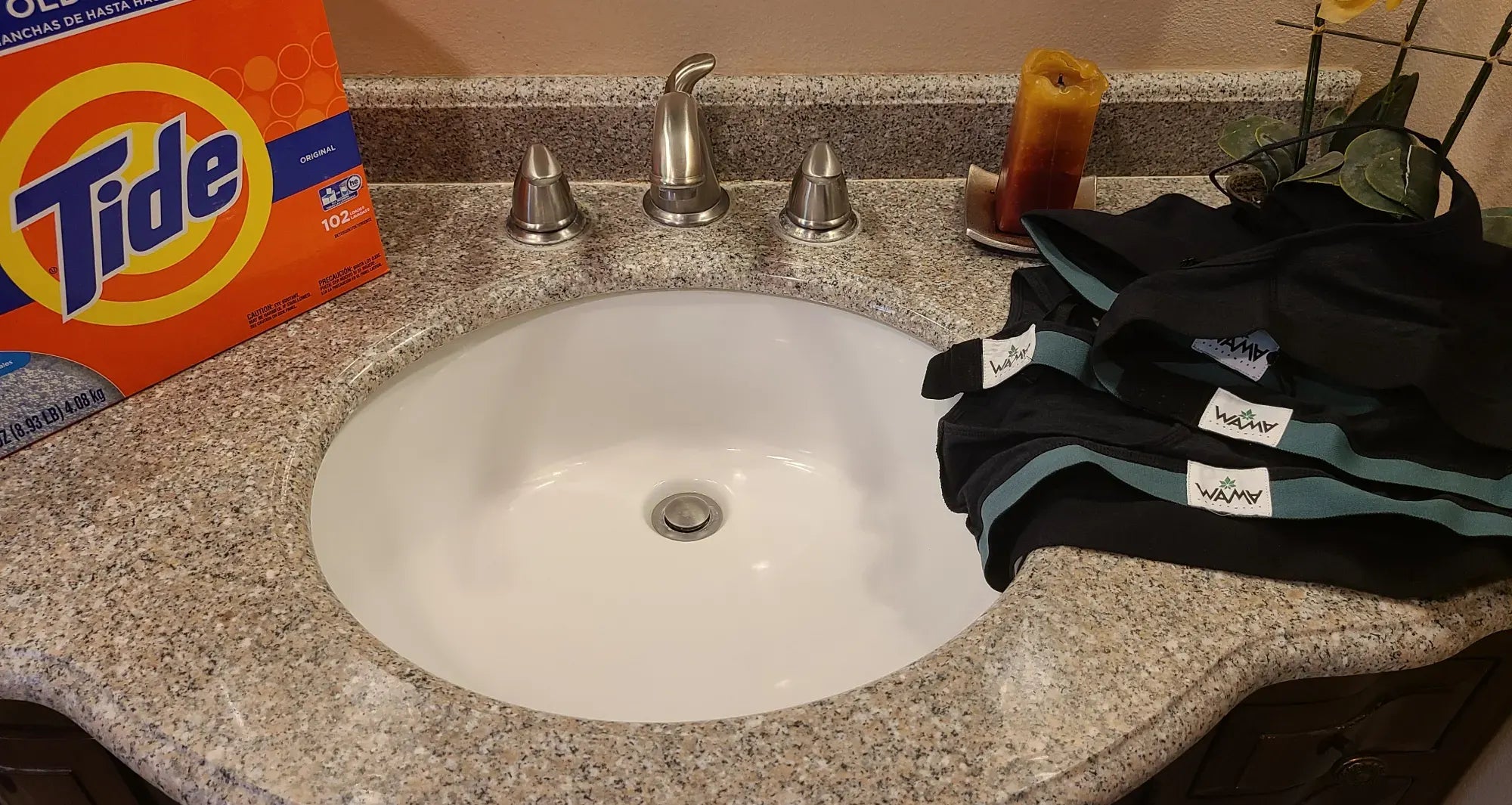 a sink with a bag of deter and a set of hemp underwear on it
