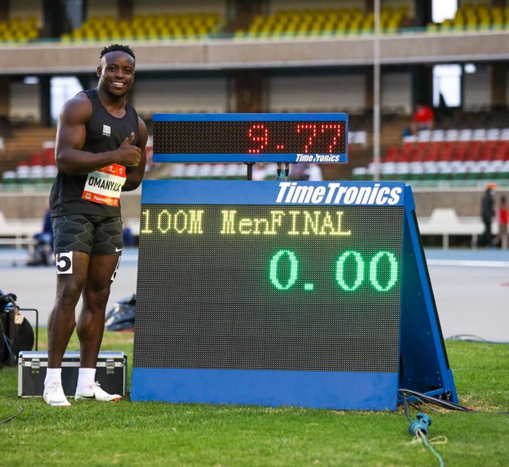 Ferdinand Omanyala celebrating his new Africa 100m record