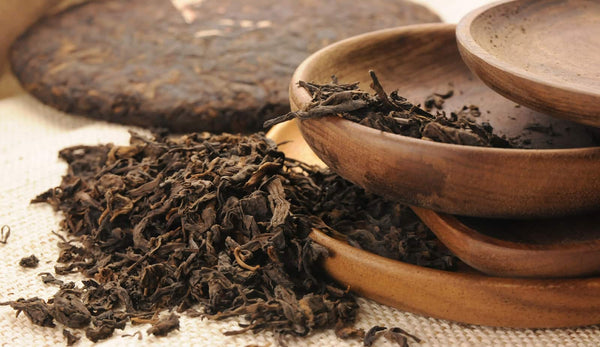 pu-erh tea with wooden plate