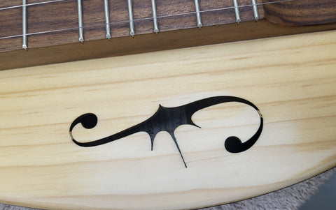 broken sound hole piece glued into place