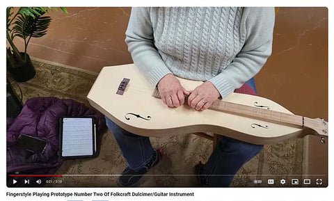 video of richard's friend susan playing fingerstyle on the second dulcimer-guitar prootype instrument