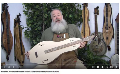 richard ash demonstrating the second prototype of their new dulcimer-guitar instrument