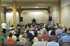 folkcraft concert hall full of people