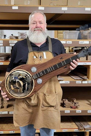 richard ash holding a folkcraft resonator dulcimer