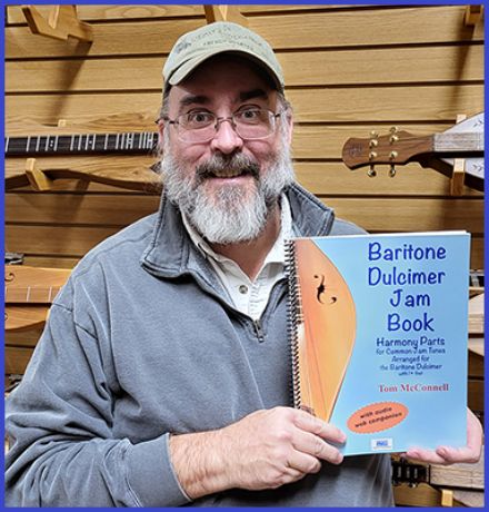 tom mcconnel posing with his baritone jam book