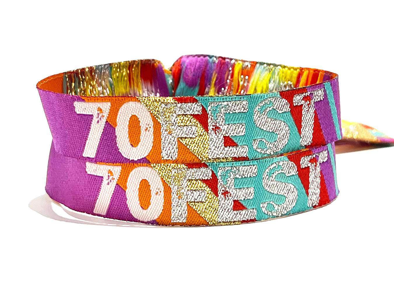 70fest festival themed 70th birthday wristbands stacked on top of each other