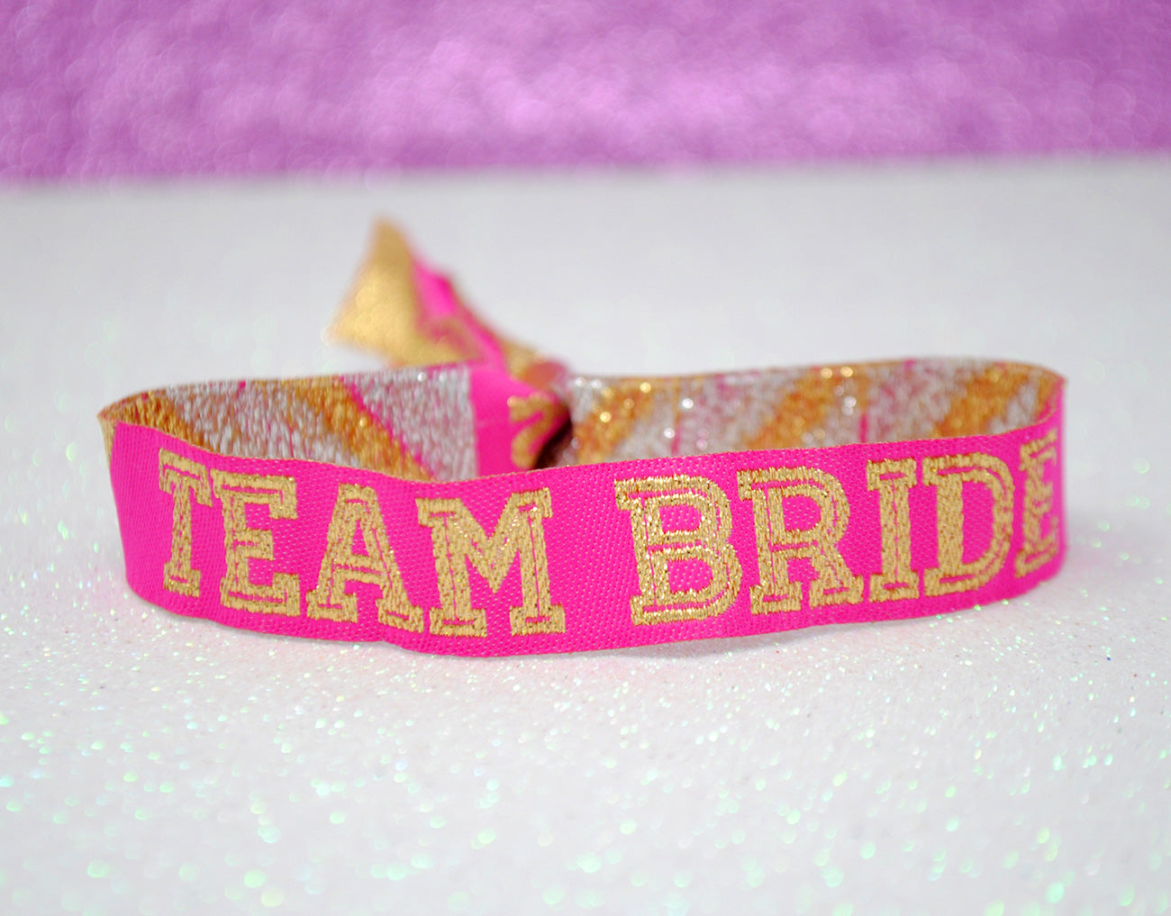 team bride hen party wristbands pink and gold