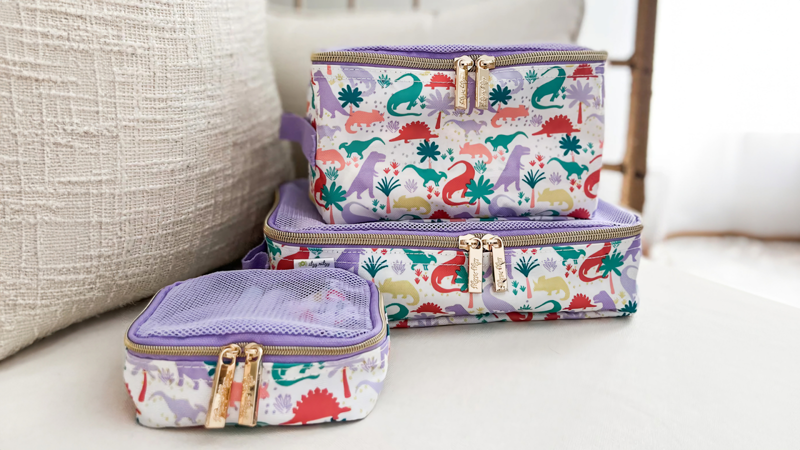 Itzy Ritzy Packing Cubes in Lilac Dinos pattern