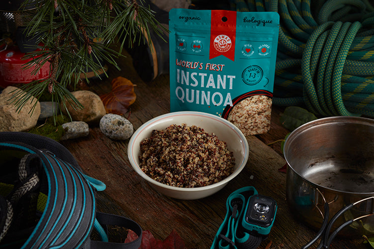 Nomad Nutrition Instant Quinoa. Nomad Nutrition Instant Quinoa. World's First Instant Quinoa. Organic, cooks in 1 to 3 minutes. Cooked quinoa featured with product in an outdoor set up.