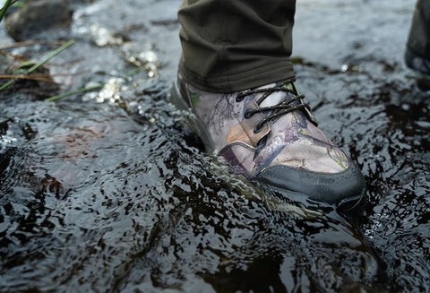 Jack Pyke Tundra Boots 2 Evo being worn to walk through muddy terrain
