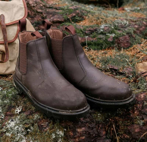 Hoggs of Fife Classic Safety Dealer Boot in brown in a field