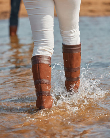 Person Wearing Dubarry Galway Boots Splashing in Water