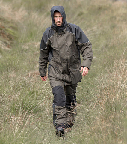 Man wearing Hoggs of Fife Field Tech Waterproof Trousers and Jacket out in the field