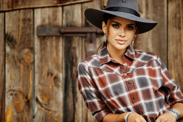 Woman Wearing Ariat Shirt and Cowboy Hat