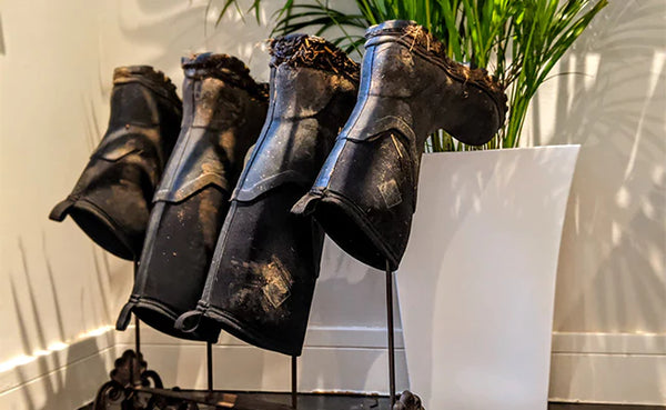 Wellies stored upside down on boot rack
