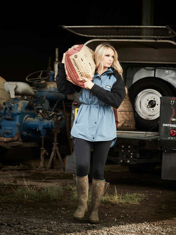 Woman wearing Ridgeline Frontier Jacket for farming