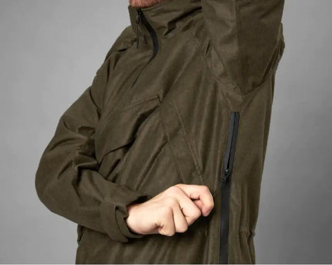 Man using the underarm ventilation feature on a waterproof smock