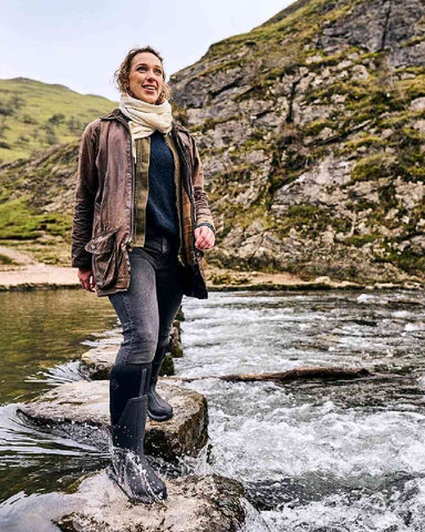 Woman Wearing Muck Boots Wellies Outside in Water