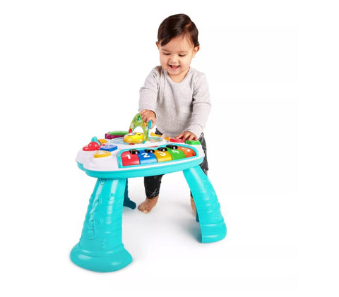 Toddler playing on an activity table