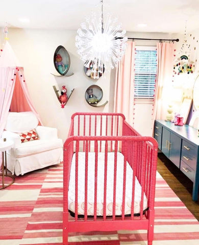 Nursery decorated in raspberry and dark blush