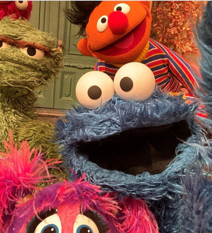 Sesame Street characters Cookie Monster, Ernie, and Oscar, on a video call