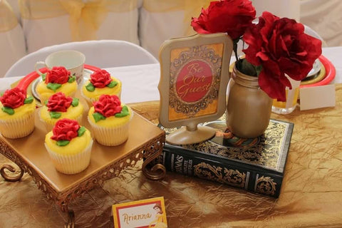 Beauty and the Beast-themed third birthday party cupcakes and centerpiece