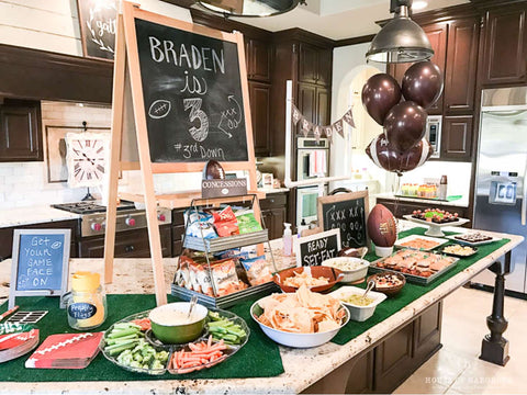 Third down football-themed third birthday party food spread