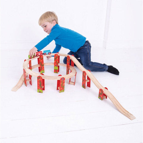 4-year-old boy playing with train set
