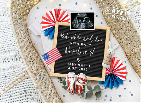 A 4th of July pregnancy announcement staged in a baby bassinet
