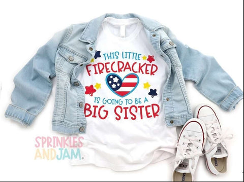 A kids 4th of July pregnancy announcement t-shirt that says "this firecracker is going to be a big sister"