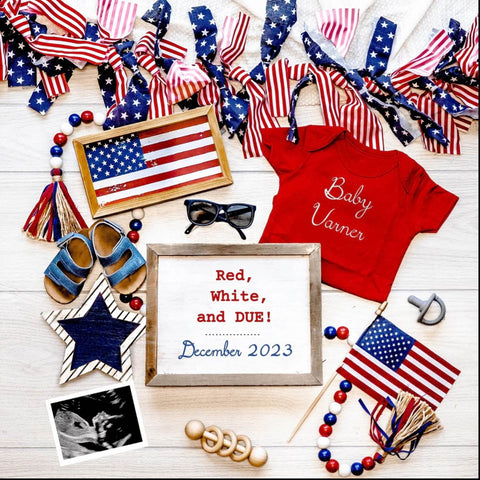 A 4th of July pregnancy announcement flatlay with American flags