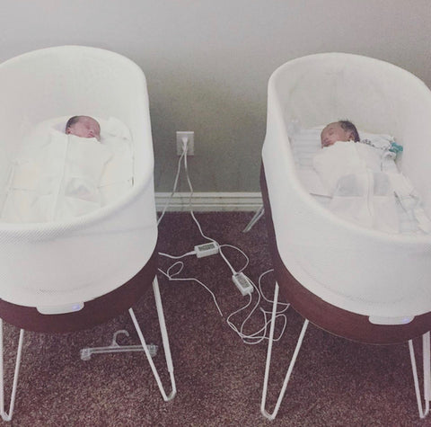 Twin babies sleeping in SNOO