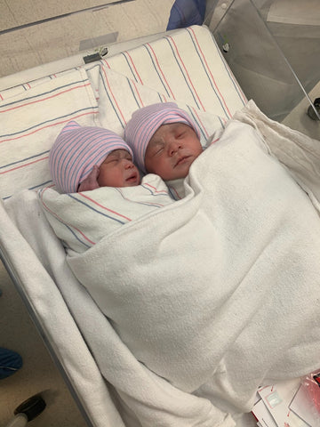 Twin newborns swaddled at the hospital