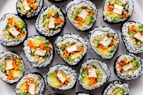 Tofu sushi being served at a baby shower