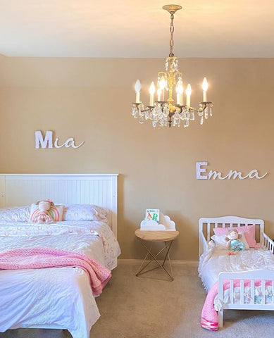 Shared kids' room with a twin-size bed and a small toddler bed