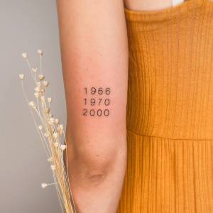 Tattoo ideas for parents: Birth years tattoo for parents