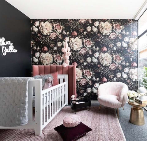 Black nursery with dark floral wallpaper