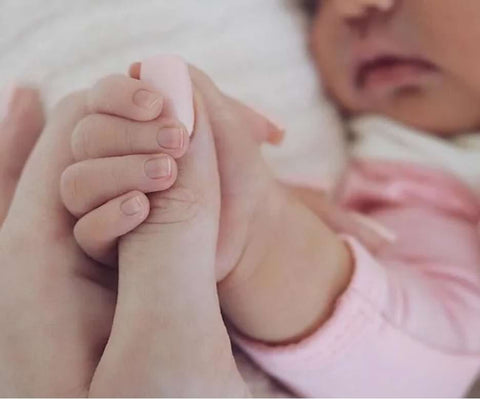Kylie Jenner's baby announcement: A photo of her newborn holding her thumb