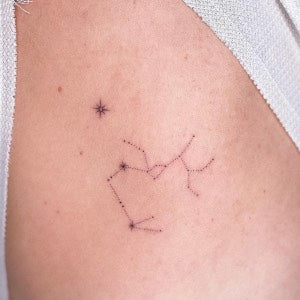 Tattoo ideas for parents: zodiac constellation tattoo