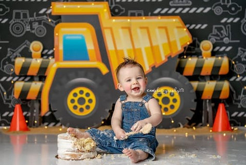 Baby and construction-vehicle-themed smash cake.