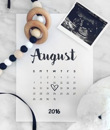 DIY pregnancy announcement photo of an August calendar with a baby's due date circled with a heart