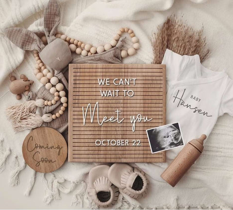 DIY pregnancy announcement photo of a letterboard that uses a digital download