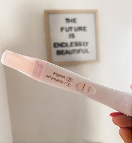 DIY pregnancy announcement photo of a positive pregnancy test