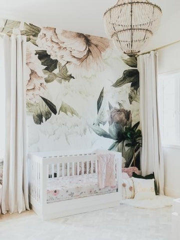 Nursery with elegant floral wallpaper