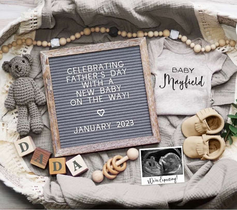 Father's Day pregnancy announcement flatlay with letterboard