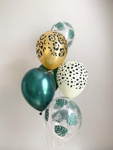 Animal- and leaf-print balloons used for a “wild one”-themed first birthday.