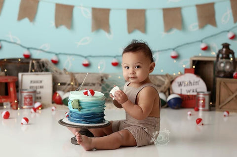Baby and fishing-themed smash cake.