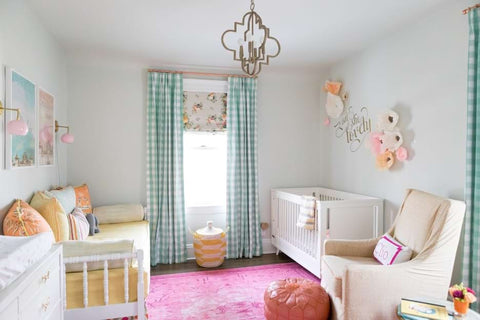 Colorful floral nursery decorated with a mix of patterns