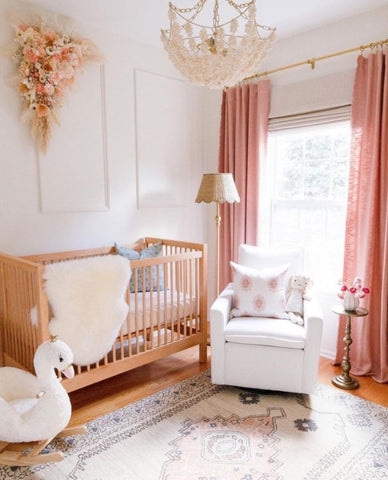 A floral nursery decorated in romantic shades of pink