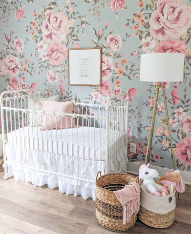 Floral nursery with teal and pink flower wallpaper